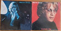Front covers of Warren Zevon 1976 debut album and 1978 Excitable Boy album showing clear artist images and titles.