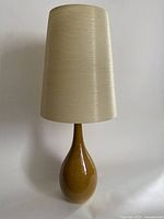 Front view of lamp showing base and shade