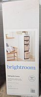 Box of Brightroom sliding bin frame with label showing image of assembled frame with three beige bins inside.
