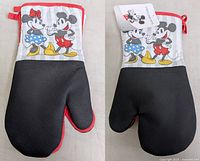 Front and back views of an oven mitt with Mickey and Minnie Mouse design, black textured grip surface and red trim, tagged new