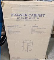 Image of the cardboard box packaging of the drawer cabinet showing specifications and dimensions.