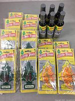 Photo of 48 Royal Pine hanging air fresheners, 24 Sliced hanging air fresheners, and 6 spray odor eliminator bottles from Little Trees.