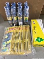 Photo showing 8 spray bottles of new car scent, 4 cans of Caribbean Colada scent spray, and 24 pieces of Pina Colada hanging scents in original packaging.