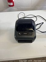 Top view of the closed Zebra ZP450 thermal label printer showing model and logo on lid.