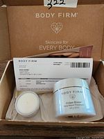 Box containing Crêpe Erase Body Repair Treatment cream jar and small sample jar with packing and receipt.