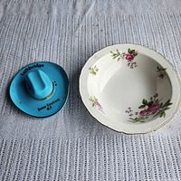 Top view of turquoise hat dish and floral bowl side by side