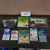 Group shot of all eight packaged lures and rigs