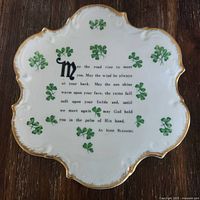Front of plate showing shamrock motif, blessing text, scalloped gilt rim