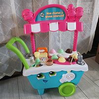 Front view of LeapFrog ice cream cart with accessories