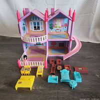 Full view of dollhouse and all accessories laid out