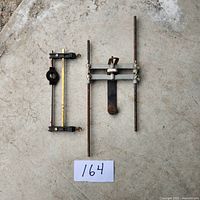 Two Tool Shop router guides laid side by side on concrete