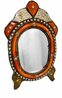 Front view of ornate Moroccan mirror showing overall design and materials