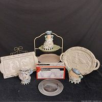 Full view of assortment showing ceramic platters, creamer, sugar bowl, vase, metal dessert stand with floral dishes, and boxed dessert cups.