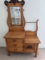 Front view of dresser showing drawers, cupboard and attached mirror