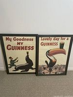 Front view of two framed Guinness art prints with vintage advertising illustrations.