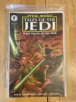 Cover of Star Wars Tales of the Jedi: Dark Lords of the Sith #1 with Jedi characters and green lightsabers.