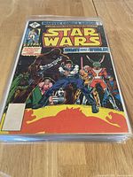 Front cover of Star Wars comic issue #8 showing main characters including Chewbacca and Han Solo, bright yellow and red title text at top.
