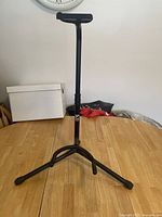 Full view of the Yorkville GS204B adjustable black instrument stand from front, showing the tripod base and height adjustment.