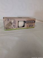 Set of three new Pure Wool Dryer Balls in box showing branding and sheep image on packaging.