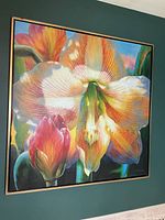 Frontal view of framed 41" square oil painting depicting orchid flowers.