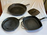 Overview of all four cast iron items on white background