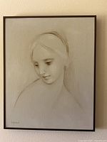 Full view of framed portrait hanging on wall