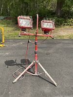 Full view of the red Power Light folding shop light with two halogen lamps on tripod stand, showing overall condition and setup.