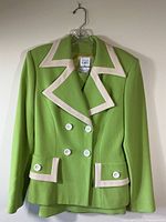 Front view of lime green Allumette blazer with cream trim and white buttons