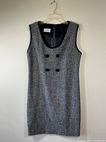 Classic 60’s sleeveless shift dress, size small, gray textured fabric with black trim, two decorative buttons on chest, back zipper, brand label 'Jerri Lynn'