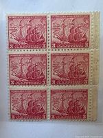 Front view of the unused block of 6 Maryland Tercentenary stamps, showing the red sailing ship design and intact perforations.