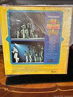 Back cover of the album with photos of The Jackson 5 performing on stage and song tracklist. Shows shrink wrap condition and cover detail.