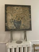 Square vintage wooden card table painted with floral motif, foldable legs visible in both closed (vertical) and open (horizontal) positions