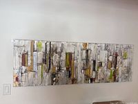Wide view of the large horizontal abstract painting on wall showing composition and colors.