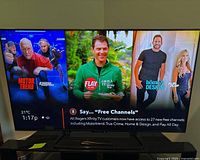 TV powered on showing home screen interface with MotorTrend, Flay All Day, Home & Design channels