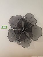 Front view showing detailed wire mesh rounded petals with clear bead accents on tips and center cluster.