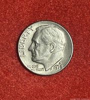 Obverse side of the 1974 D dime showing Roosevelt's profile, mint mark, and date with visible triangle stamp error.