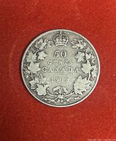 Reverse of the 1918 Canadian 50-cent coin showing denomination, date, and maple leaf wreath.