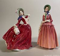 Both porcelain figurines side by side on a neutral background