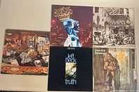 Five vintage classic rock vinyl albums displayed together, showing front covers including Jethro Tull 'Aqualung', Jeff Beck 'Truth', Frank Zappa, and others.
