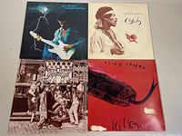 Four album covers displayed flat: Jimi Hendrix 'Midnight Lightning', Jimi Hendrix 'Crash Landing', Alice Cooper 'Greatest Hits', Alice Cooper 'Killer'
