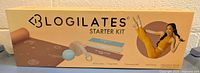 Front of the Blogilates Starter Kit box showing the kit name, logo, and an image of the contents including yoga mat, resistance bands, mat strap, and massage ball.