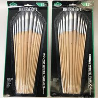 Two packaged 12-piece brush sets, each labeled 'Round White Taklon Medium' by Royal & Langnickel