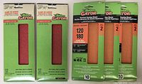 Two packs of Gator clamp-on sanders with 12 sanding sheets each in green packaging showing red sanding sheets inside.