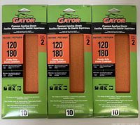 Three packages of Gator Premium sanding sheets, each package containing 10 sheets, showing the front packaging indicating grit 120-180.