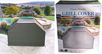 Photo of the reversible grill cover outdoors and its packaging box showing product image and outdoor setting.