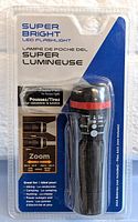 Front of package showing the Jacent LED flashlight and its features including zoom range and push/pull focus.