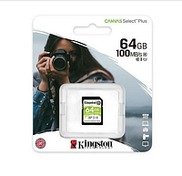 Packaged Kingston Canvas Select Plus 64GB SD card showing front blister pack with camera photograph background, specifications indicating 64GB capacity and 100MB/s speed.