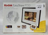 Front of Kodak EasyShare P720 digital photo frame box showing product name and image of the frame with a child photo displayed.