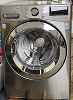 Front view showing door, control panel and drum