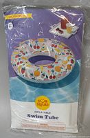Photo of packaged Sun Squad Inflatable Swim Tube with fruit graphics on packaging indicating 31-inch diameter
